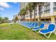 Inviting pool deck with rows of lounge chairs and palm trees offers a tranquil relaxation spot at 2000 N Ocean Blvd. # 1601, Myrtle Beach, SC 29577