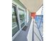 Balcony features views through sliding glass doors and a grey floor at 2007 S Ocean Blvd. # 204, Myrtle Beach, SC 29577