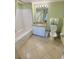 Well-lit bathroom with a tub-shower combination, a granite-topped vanity, and ample storage at 2007 S Ocean Blvd. # 204, Myrtle Beach, SC 29577