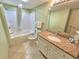 Clean bathroom with a tub and shower, updated vanity, and ample lighting for a refreshing experience at 2007 S Ocean Blvd. # 204, Myrtle Beach, SC 29577