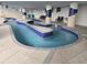 Serene indoor lazy river pool with decorative columns and blue water at 2007 S Ocean Blvd. # 204, Myrtle Beach, SC 29577