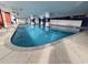 Indoor swimming pool surrounded by decorative columns and blue water at 2007 S Ocean Blvd. # 204, Myrtle Beach, SC 29577