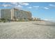 Wide sandy beach in front of resort, perfect for leisurely strolls and relaxation at 201 74Th Ave. N # 2941, Myrtle Beach, SC 29572