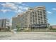 Modern resort exterior with multiple floors and balconies, offering stunning ocean views at 201 74Th Ave. N # 2941, Myrtle Beach, SC 29572