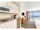 Efficient kitchenette in a condo with stove, microwave, and ocean view access at 201 74Th Ave. N # 2941, Myrtle Beach, SC 29572