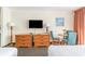 Well-lit living area in a condo with a TV, furnishings, and ocean view balcony at 201 74Th Ave. N # 2941, Myrtle Beach, SC 29572