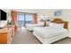 Comfortable main room with two beds, ocean view access, and cozy decor at 201 74Th Ave. N # 2941, Myrtle Beach, SC 29572