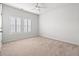 Bright bedroom with plush carpeting and plantation shutters on the windows at 2015 Borgata Loop, Longs, SC 29568
