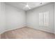 Bright bedroom with plush carpet, a ceiling fan, and window providing natural light at 2015 Borgata Loop, Longs, SC 29568