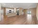 Open-concept living space featuring hardwood floors, white cabinets, and granite countertops at 2015 Borgata Loop, Longs, SC 29568