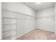 Spacious walk-in closet features extensive wire shelving for optimal organization and storage space at 2015 Borgata Loop, Longs, SC 29568