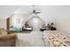 A bedroom with vaulted ceilings, a ceiling fan, a window seat, two beds, and carpeted floors at 205 Deep Blue Dr., Myrtle Beach, SC 29579