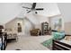 A bedroom with vaulted ceilings, a ceiling fan, a window seat, two beds, and carpeted floors at 205 Deep Blue Dr., Myrtle Beach, SC 29579