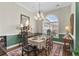 Formal dining room with large window, decorative chandelier and beautiful wainscoting at 205 Deep Blue Dr., Myrtle Beach, SC 29579