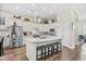 Contemporary kitchen features an island with seating, stainless steel appliances, and ample cabinet space at 205 Deep Blue Dr., Myrtle Beach, SC 29579