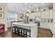 Modern kitchen featuring an island, granite countertops, stainless steel appliances, and stylish pendant lighting at 205 Deep Blue Dr., Myrtle Beach, SC 29579