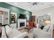 Spacious living room boasts a fireplace, modern lighting, and seamless transition to other spaces at 205 Deep Blue Dr., Myrtle Beach, SC 29579
