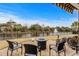Enjoy the tranquil backyard pond views from this patio with a cozy fire pit area at 205 Deep Blue Dr., Myrtle Beach, SC 29579
