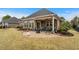 Inviting brick patio with a fire pit and comfortable seating, perfect for outdoor gatherings at 205 Deep Blue Dr., Myrtle Beach, SC 29579