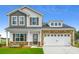 Charming two-story home featuring mixed siding, stone accents, and an attached two-car garage at 206 Portofino Dr., Myrtle Beach, SC 29579