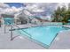 Beautiful community pool featuring a covered lounge area with blue lounge chairs at 206 Portofino Dr., Myrtle Beach, SC 29579