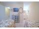 Well-lit bedroom featuring twin beds, dresser, and an open view to the bathroom at 210 25Th Ave. S # 26, Myrtle Beach, SC 29577