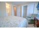 Bedroom boasts natural light, an armchair, closet, and access to another bedroom at 210 25Th Ave. S # 26, Myrtle Beach, SC 29577