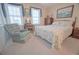 Bedroom with comfortable armchair, vanity table, and bright windows at 210 25Th Ave. S # 26, Myrtle Beach, SC 29577