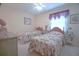 Cozy bedroom with two beds, floral comforters, and soft lighting at 210 25Th Ave. S # 26, Myrtle Beach, SC 29577