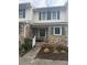 Charming townhome facade featuring brick exterior, blue shutters, and a welcoming porch at 210 25Th Ave. S # 26, Myrtle Beach, SC 29577