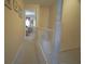 Hallway view leads to the main bedroom area with neutral carpet and paint at 210 25Th Ave. S # 26, Myrtle Beach, SC 29577