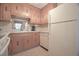 Functional kitchen features wood cabinets, white appliances, and a clean, well-maintained space at 210 25Th Ave. S # 26, Myrtle Beach, SC 29577
