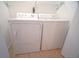 Functional laundry area with a white washer and dryer at 210 25Th Ave. S # 26, Myrtle Beach, SC 29577