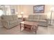 Inviting living room featuring neutral-toned couches and a wooden coffee table at 210 25Th Ave. S # 26, Myrtle Beach, SC 29577
