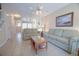 Bright living room with tile floors, comfy sofas, and decorative mirrors at 210 25Th Ave. S # 26, Myrtle Beach, SC 29577