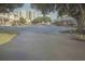 Wide street view of townhomes and a high rise tower in the background at 210 25Th Ave. S # 26, Myrtle Beach, SC 29577