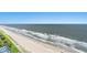 Expansive aerial shot of the beach and ocean, showing the coastline and gentle waves at 2201 S Ocean Blvd. # 1806, Myrtle Beach, SC 29577