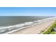 Wide aerial view capturing the expansive beach and ocean, under a bright, clear sky at 2201 S Ocean Blvd. # 1806, Myrtle Beach, SC 29577