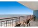 Inviting balcony featuring seating and picturesque ocean views on a sunny day at 2201 S Ocean Blvd. # 1806, Myrtle Beach, SC 29577