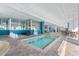 Indoor hot tub with tables, chairs, a chess set and large windows, all under a bright white ceiling at 2201 S Ocean Blvd. # 1806, Myrtle Beach, SC 29577