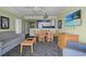 Inviting dining area with a table and chairs next to a well-appointed living space and kitchen at 2201 S Ocean Blvd. # 1806, Myrtle Beach, SC 29577