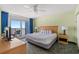 Comfortable bedroom with a king-sized bed, balcony access, and a relaxing ocean view at 2201 S Ocean Blvd. # 1806, Myrtle Beach, SC 29577