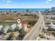 Panoramic aerial view of home location with beach, marsh, and nearby highway access at 2304 Pointe Marsh Ln., North Myrtle Beach, SC 29582