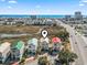 Aerial shot showcasing the beach house's location near the ocean, marsh, and coastal highway at 2304 Pointe Marsh Ln., North Myrtle Beach, SC 29582