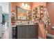 Bathroom with vanity, marble countertop, framed mirror, and decorative display shelves at 2304 Pointe Marsh Ln., North Myrtle Beach, SC 29582