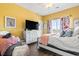 Sunny bedroom with a large window, a white dresser, and colorful decor for a vibrant feel at 2304 Pointe Marsh Ln., North Myrtle Beach, SC 29582
