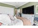 Calm bedroom with green walls, a comfortable bed, and a view of the closet and entryway at 2304 Pointe Marsh Ln., North Myrtle Beach, SC 29582
