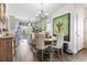 Dining area featuring a round table, comfortable chairs, and stylish decor adjacent to the kitchen at 2304 Pointe Marsh Ln., North Myrtle Beach, SC 29582