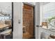 Unique home elevator with decorative metal door, blending functionality and charm at 2304 Pointe Marsh Ln., North Myrtle Beach, SC 29582