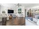 Open-concept living room boasts hardwood floors, stylish decor, and a comfortable seating arrangement at 2304 Pointe Marsh Ln., North Myrtle Beach, SC 29582